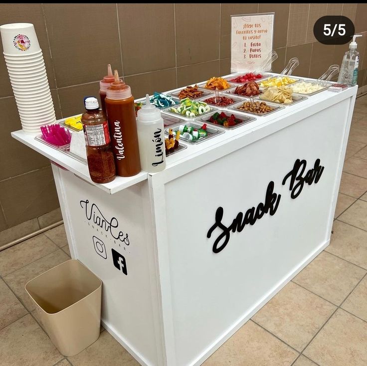 there is a food stand with drinks on it