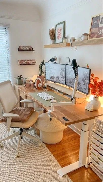 a home office with two computer screens on the desk and chairs in front of it