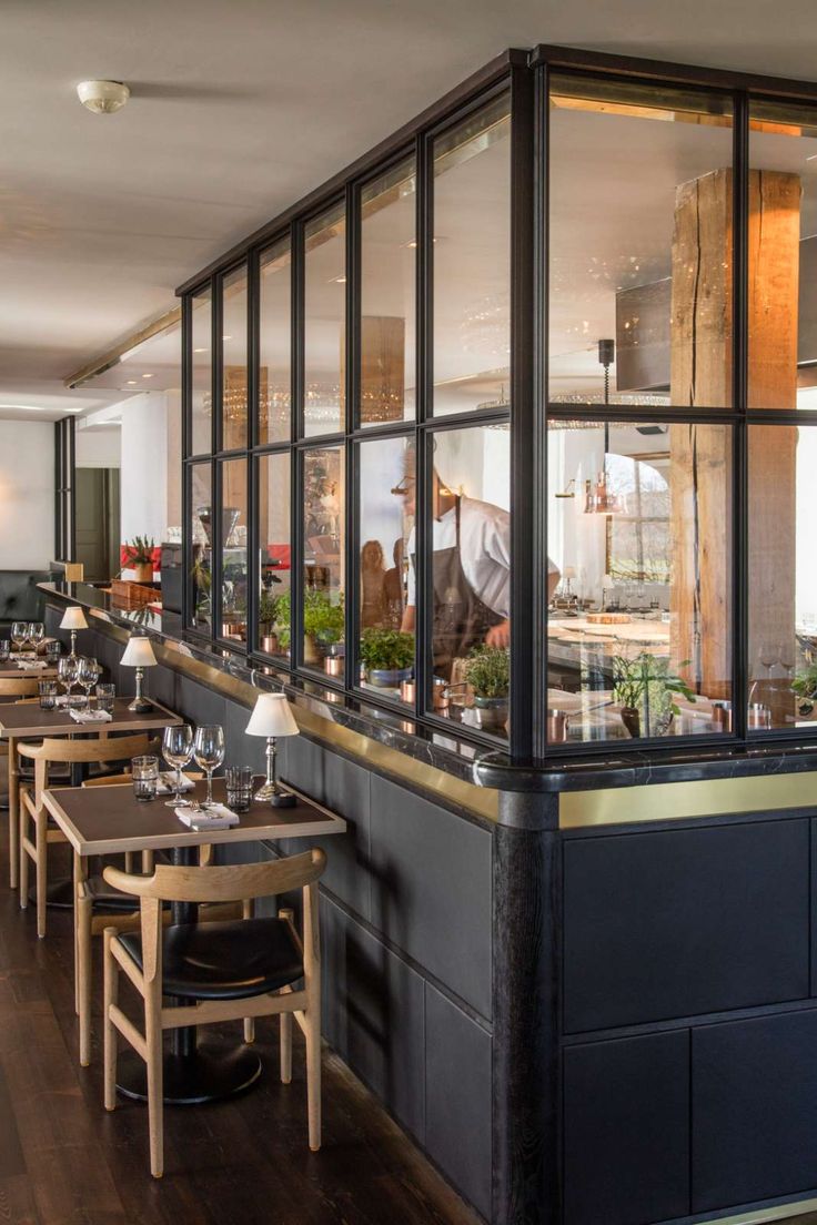 an empty restaurant with tables and chairs