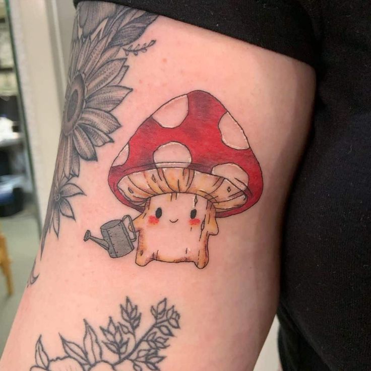 a mushroom tattoo on the right thigh