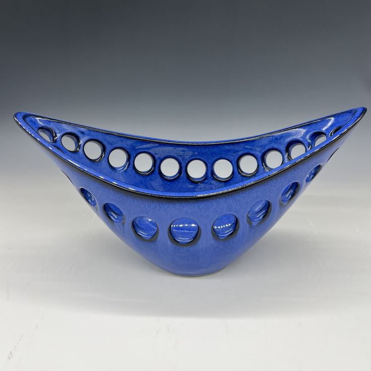 a blue bowl with white dots on it