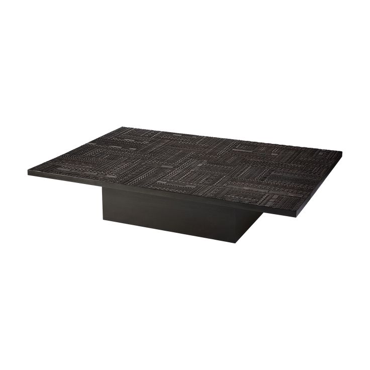 a black table that is sitting on top of a white surface and has an interesting design