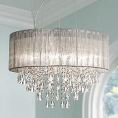 a chandelier hanging from the ceiling in a room