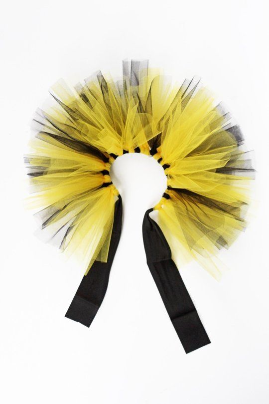 a yellow and black tulle on a white background