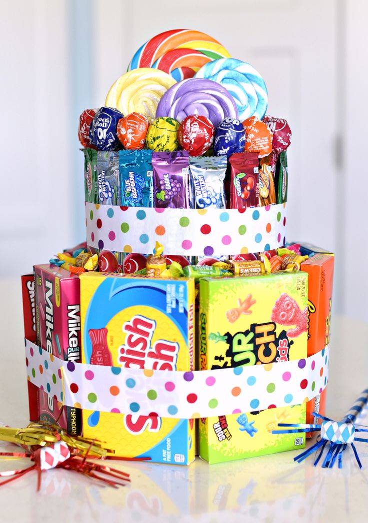 an assortment of candies and lollipops are stacked on top of each other