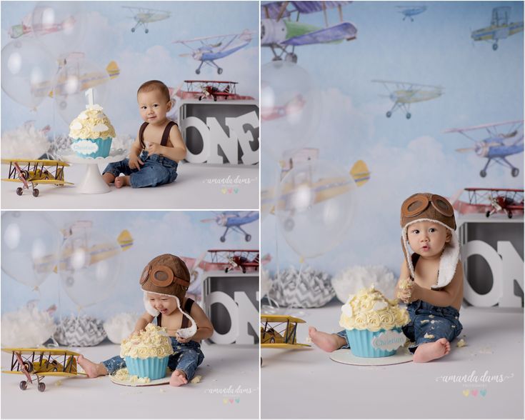 a baby boy sitting on the floor in front of a cupcake and airplane backdrop