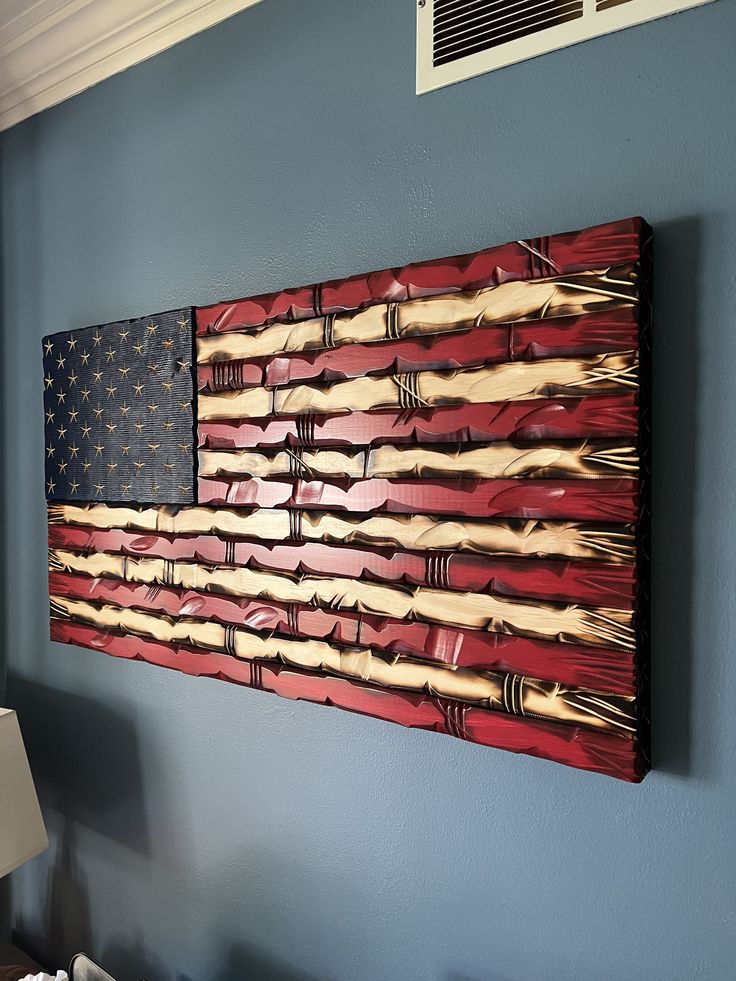 an american flag is hanging on the wall