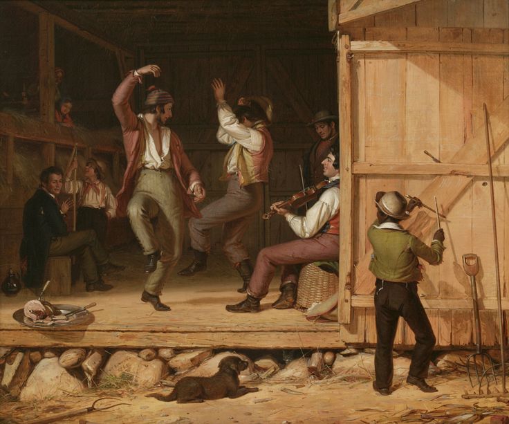 an image of a group of people dancing in a barnyard with other people watching