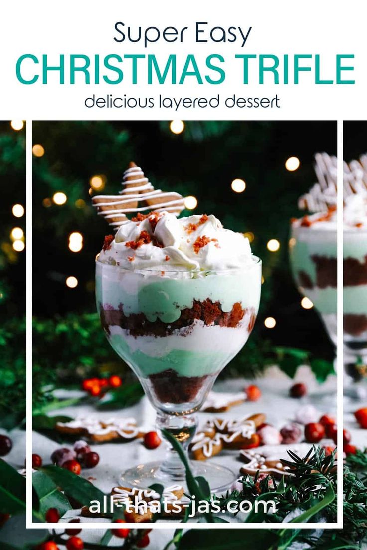 two glasses filled with dessert and topped with whipped cream, cranberry toppings