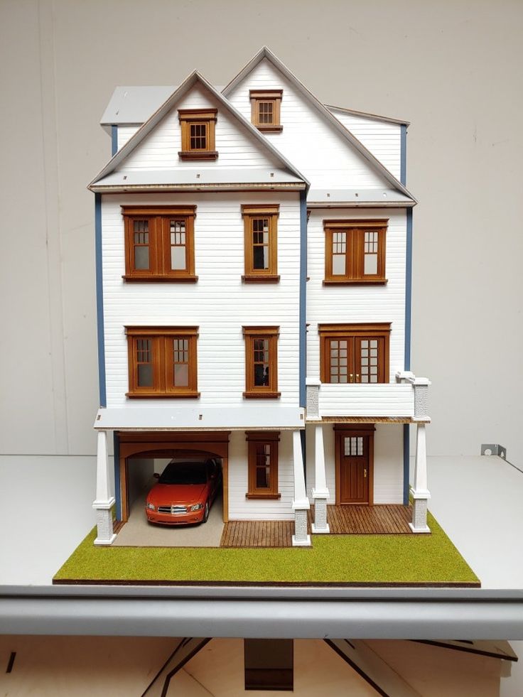 a model house with a car in the garage