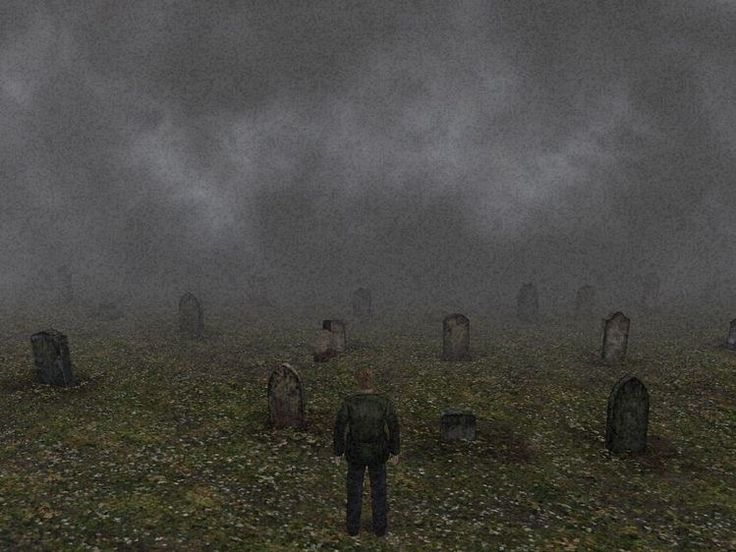 a man standing in the middle of a graveyard