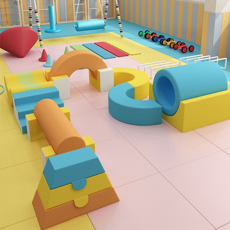 an indoor play area with colorful furniture and toys