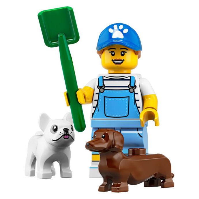 a lego man with two dogs holding a green shovel and a white dog standing next to him