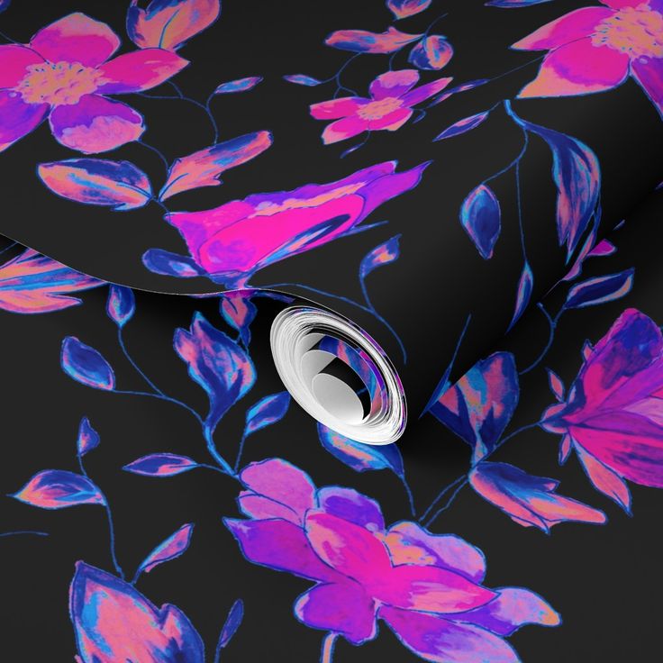 a black background with pink and blue flowers