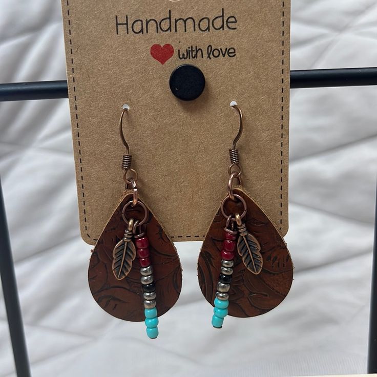 the earrings are made with leather and beads