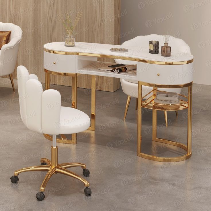 a white and gold desk with chairs around it