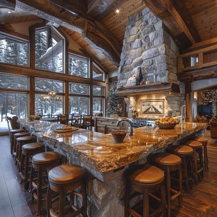 a large kitchen with granite counter tops and an island in front of the stove top