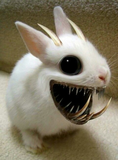 a small white rabbit with large black eyes and long, metal spikes on it's head