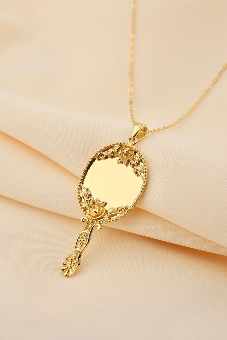 14k Solid Gold Hand Mirror Necklace - Miniature Makeup Mirror Gold Pendant This solid gold dainty Necklace is made entirely from 14k solid gold. * Jewelry is packaged and shipped in a delicate jewelry gift box. * If you are purchasing it as a gift, please feel free to add a personal note. Anniversary, Gift For Wife, Christmas Gift Gold Kt: 14K solid gold * Guaranteed Authentic 14k Gold, NOT Plated Or Filled * Stamp: 14K Vintage Clavicle Chain Jewelry For Wedding, Formal Clavicle Chain Jewelry For Mother's Day, Elegant 14k Stamped Jewelry For Valentine's Day, Formal Round Pendant Jewelry For Mother's Day, Yellow Gold Clavicle Chain Jewelry For Mother's Day, Elegant Gold Plated Jewelry For Birthday Gift, Vintage Jewelry For Mother's Day Gift, Vintage Jewelry Gift For Mother's Day, Vintage Mother's Day Jewelry Gift For Her