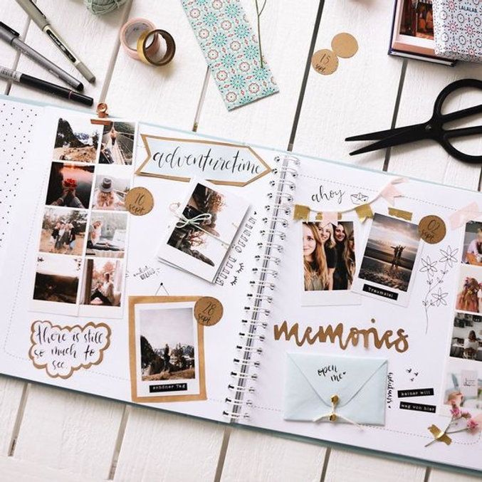 an open planner with photos and writing on it