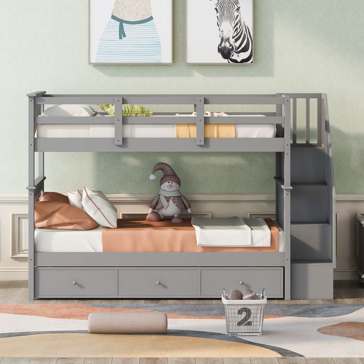 a gray bunk bed with drawers underneath it