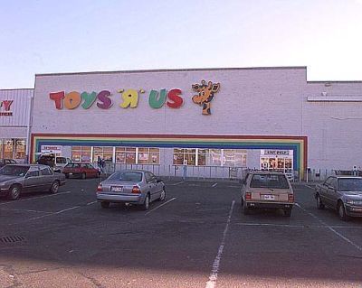 toys r us store with cars parked in the lot