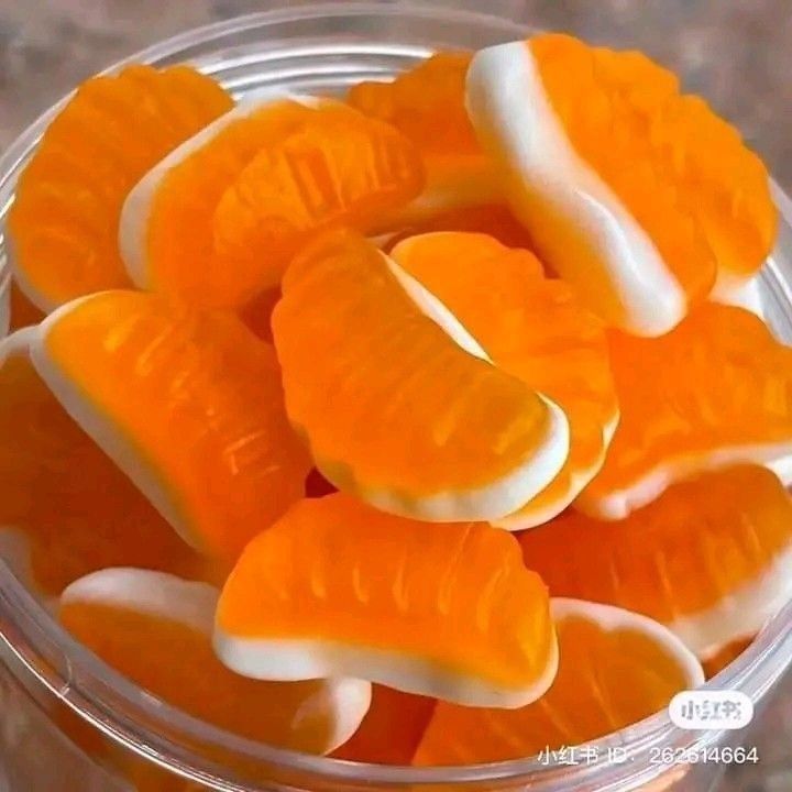 peeled oranges in a plastic container on a table