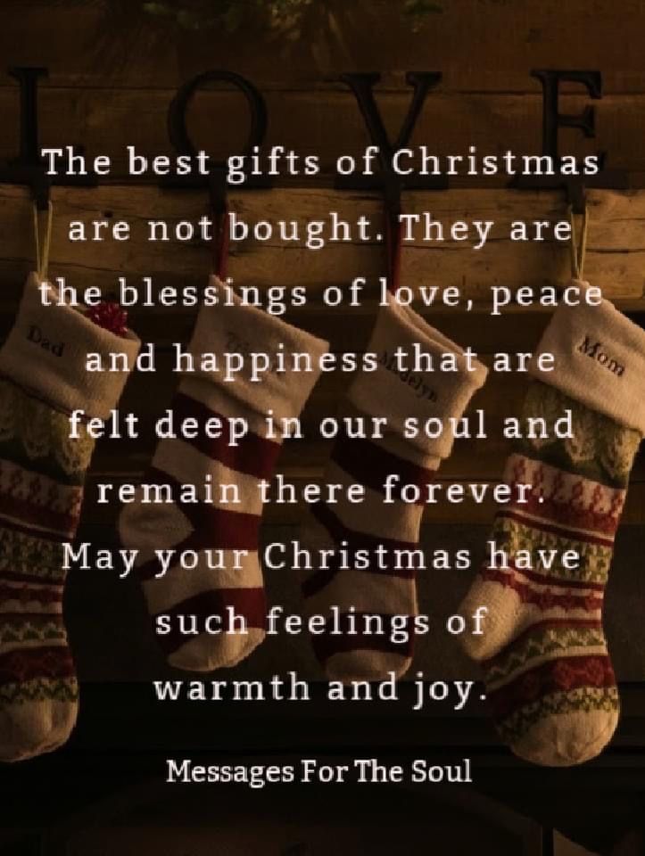 christmas stockings hanging from a wall with the words love on it and two sayings below