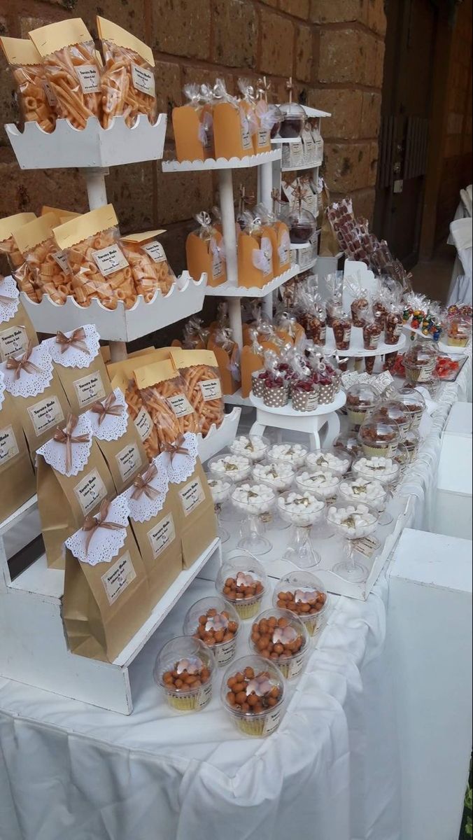 an assortment of desserts and pastries displayed on a table