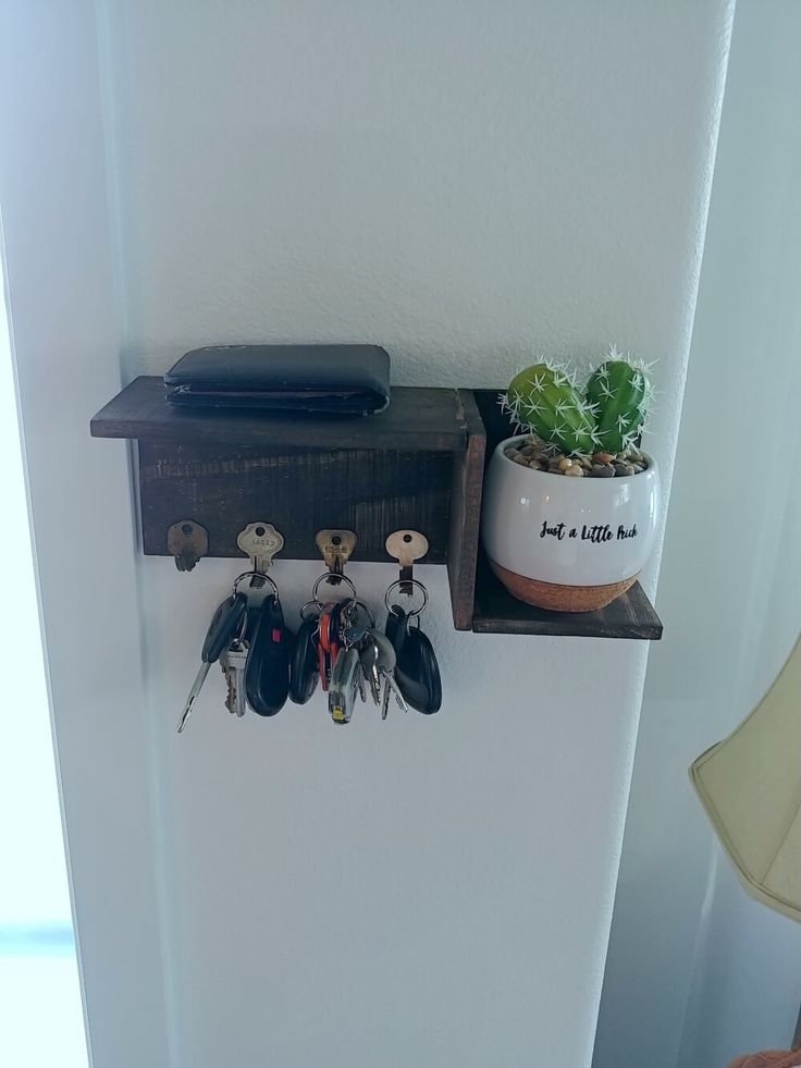 there is a shelf with keys and other things on it