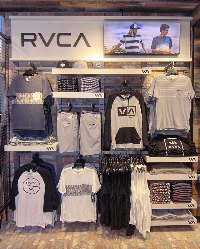 an rvca store with shirts and t - shirts on display