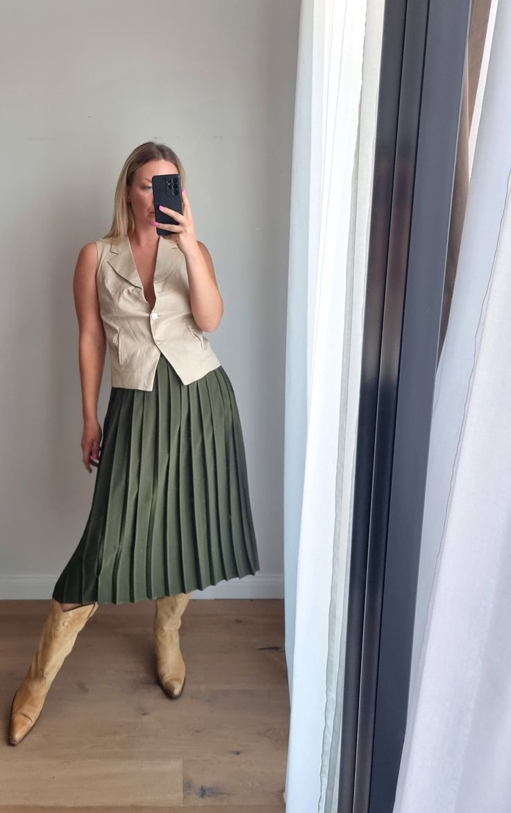 vintage khaki pleated long skirt. good vintage condition. the item is hand-picked, one and only, not new. no tags. very light material, maybe handmade. for your reference, model wears size S/M, is 175 cm tall and 62 kg weight, usual pants/skirt size - 36 EU (UK 10). Casual Beige Pleated Skirt With Accordion Pleats, Chic Khaki Skirt For Fall, Pleated Khaki Bottoms For Fall, Khaki Pleated Bottoms For Fall, Khaki Long Skirt For Workwear, Khaki Pleated Midi Skirt, Fall Pleated Khaki Bottoms, Khaki Long Pleated Skirt, Spring Pleated Khaki Skirt