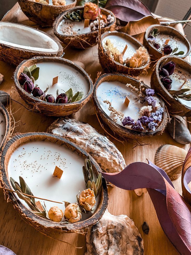 several baskets filled with food sitting on top of a wooden table next to other items