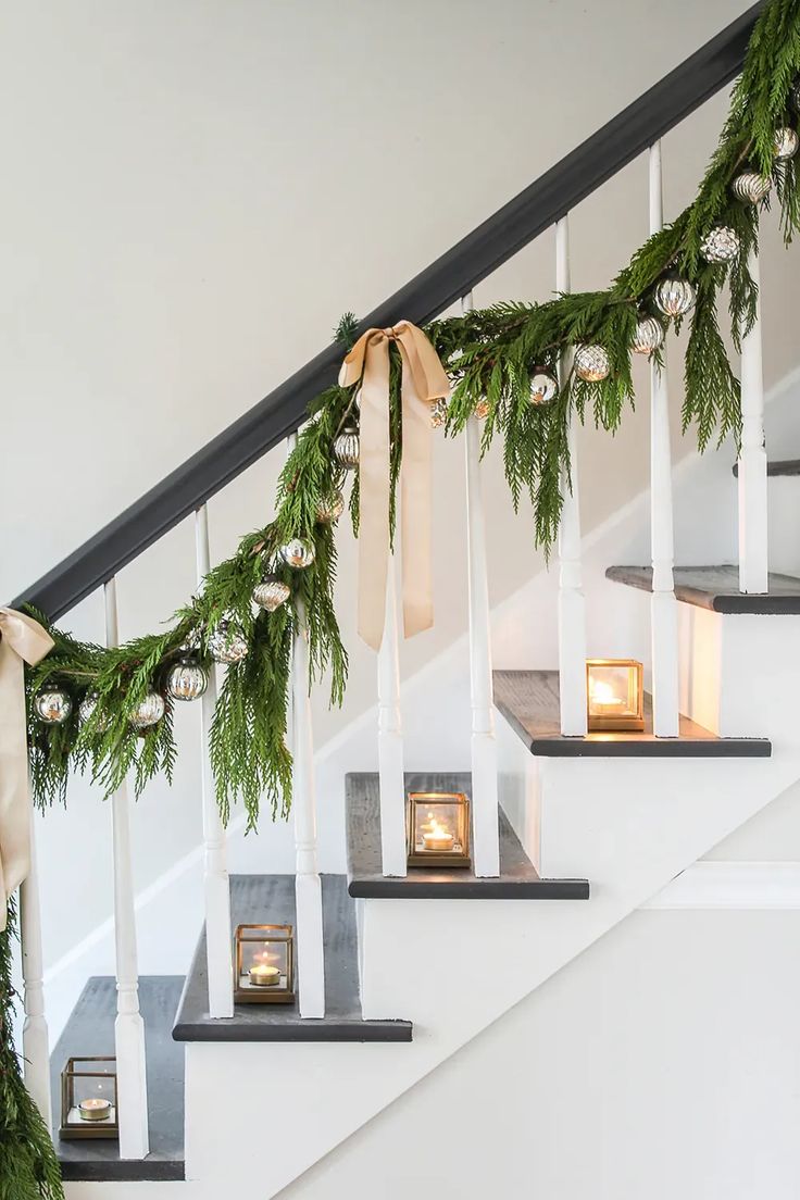 christmas decorations on the banisters and stairs