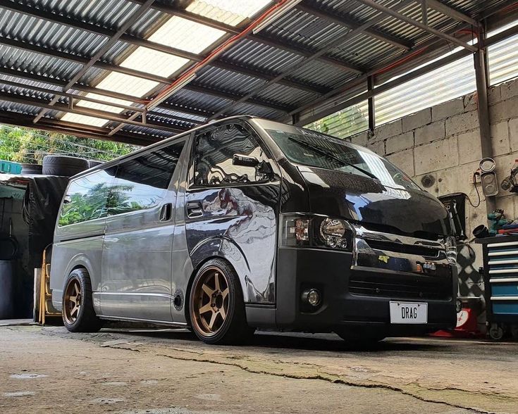 a silver van parked inside of a garage