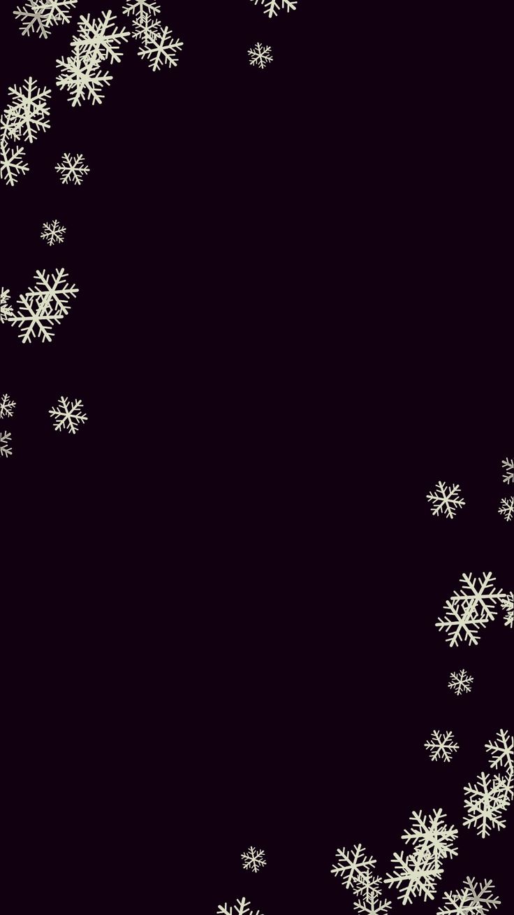 snow flakes are falling down on a black background