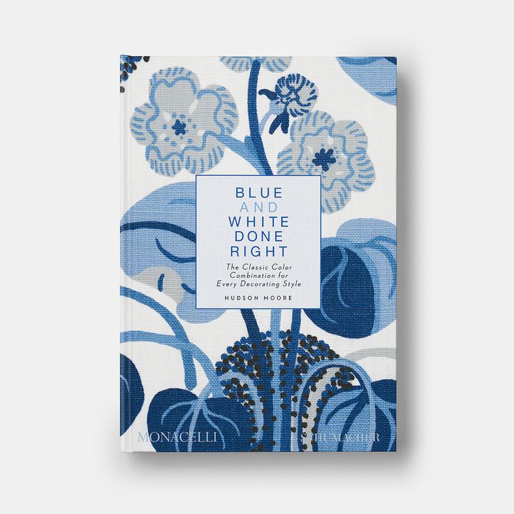 the blue and white book cover is shown with flowers on it, which are in front of