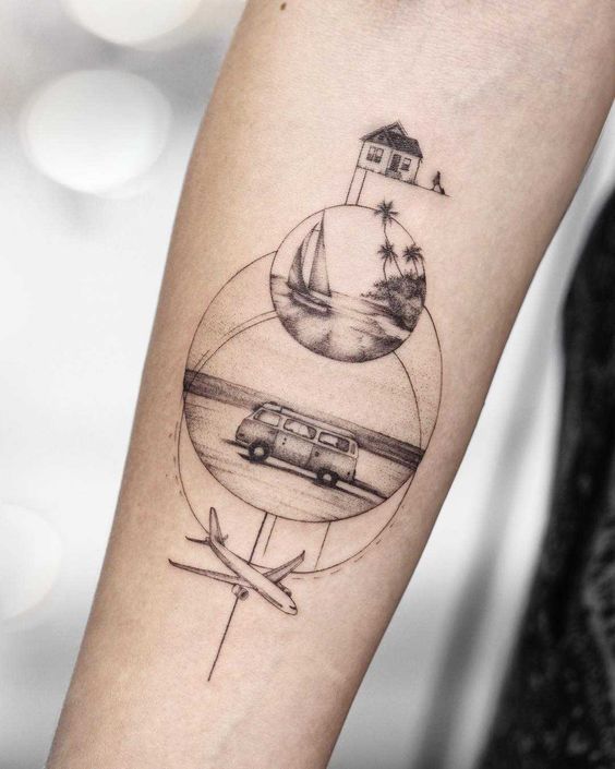 a person with a tattoo on their arm that has an image of a plane and a house