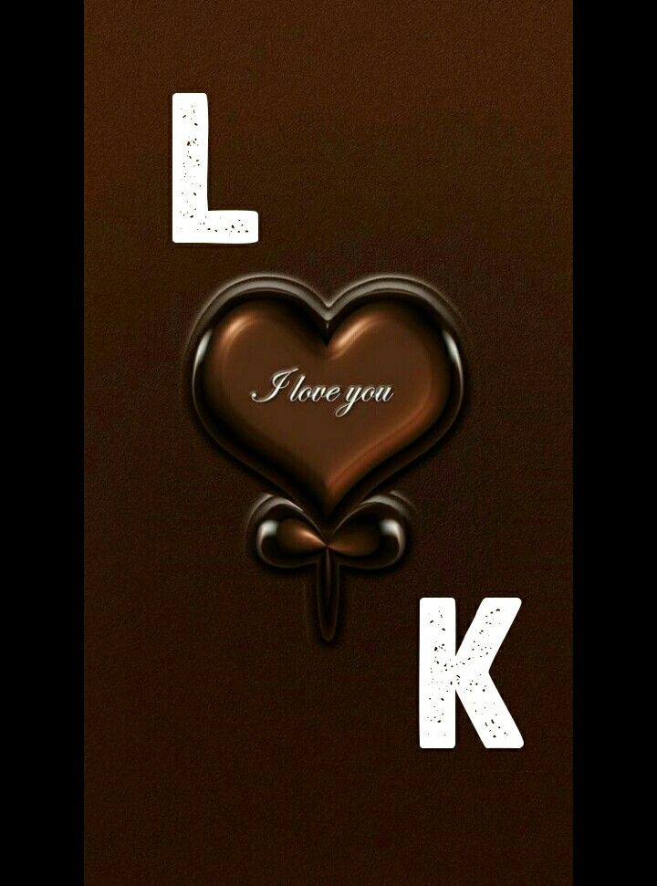 i love you k is written on the back of a brown card with a heart