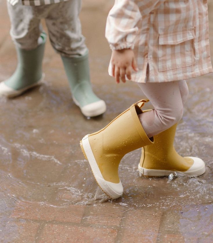 Perfect for rainy day adventures, these Toddler Rain Boots are designed in waterproof rubber. Discover thoughtful details like the extended twill finger loop for easy on-and-offs and the embossed heel. With slip resistant soles, the Rain Boot comes in three colors to Pehr with the Park Jacket, the perfect Rainwear for the coming season. Click "Find Your Size" for our Printable size chart to get the perfect fit! 100% Natural Rubber BPA Free Runs small: We recommend sizing up 2 sizes for most comf Cute Rain Boots, Toddler Rain Boots, Toddler Wearing, Kids Rain Boots, Honey Yellow, Rain Boot, Buy Buy Baby, Rainy Day Outfit, Mini Boden