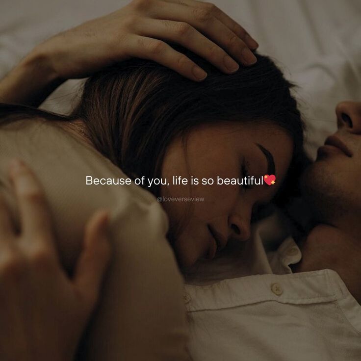 a man and woman laying in bed with the caption because of you, life is so beautiful