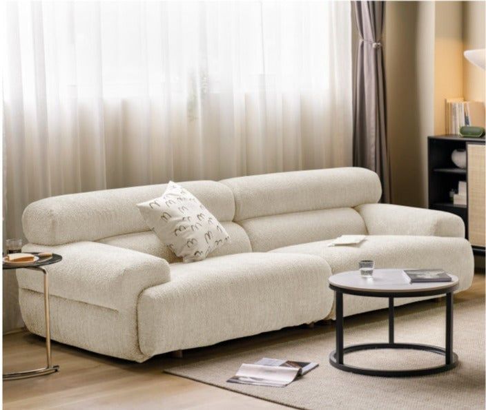 a living room scene with focus on the sofa