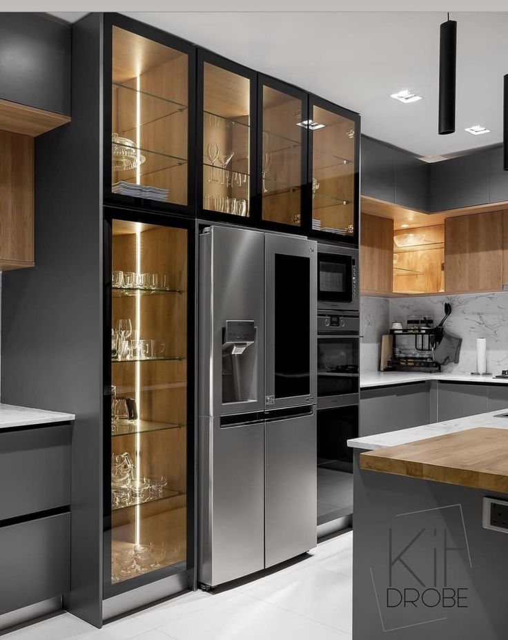 a kitchen with stainless steel appliances and wooden cabinets