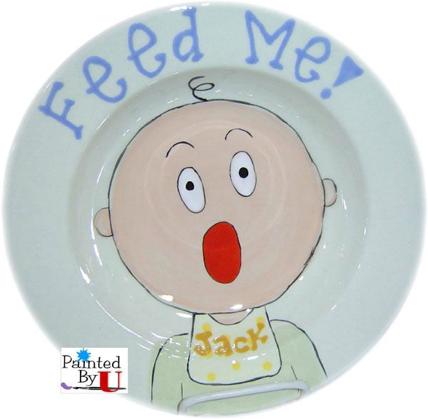 a plate with a cartoon face on it that says feed me, and has an image of a baby in the middle