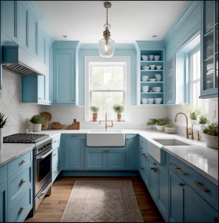 a kitchen with blue cabinets and white counter tops, an oven, sink and dishwasher