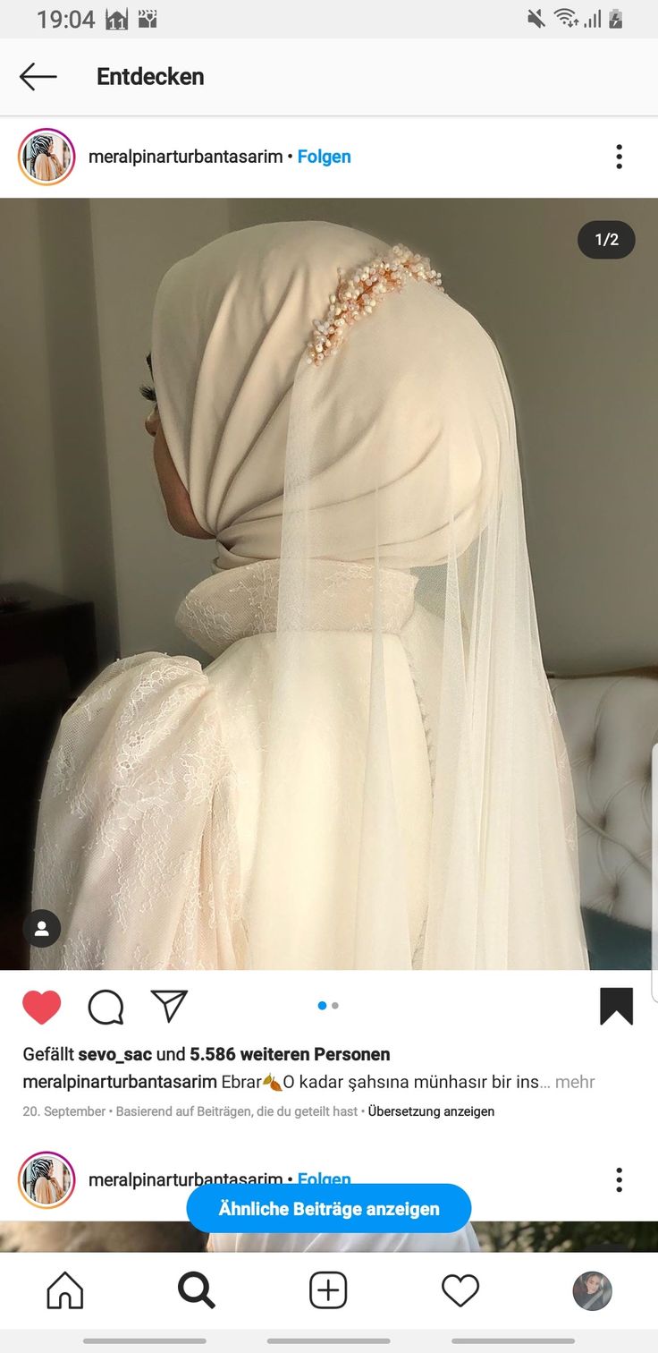 a woman wearing a veil on her wedding day