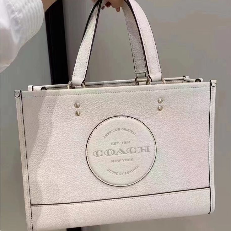 Refined Pebble Leather Inside Zip, Cell Phone And Multifunction Pockets Snap Closure, Fabric Lining Handles With 5 1/4" Drop Detachable Strap With 20" Drop For Shoulder Or Crossbody Wear 11 1/2" (L) X 8 3/4" (H) X 5" (W) Style No. C2004 Coach Market Tote, Coach Zip Top Tote, Black Tote Purse, Leopard Tote, Coach Tote Bags, Carryall Tote, Coach Tote, Quilted Totes, Zip Tote