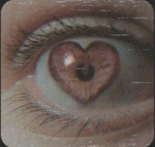 an eye with the reflection of a heart in it's irise, as seen from above