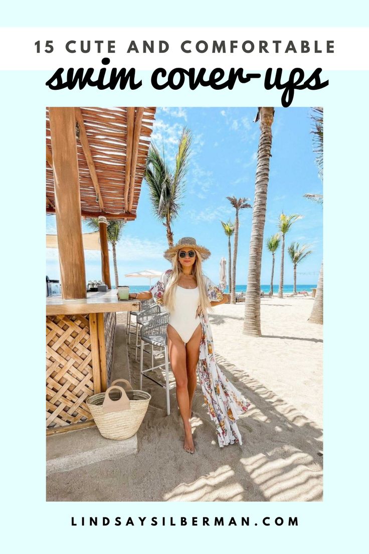 a woman in a white swimsuit on the beach with palm trees and blue sky