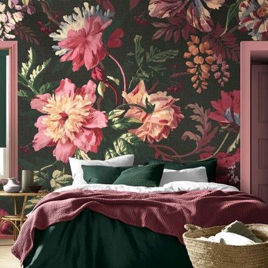 a bedroom with floral wallpaper and pink walls